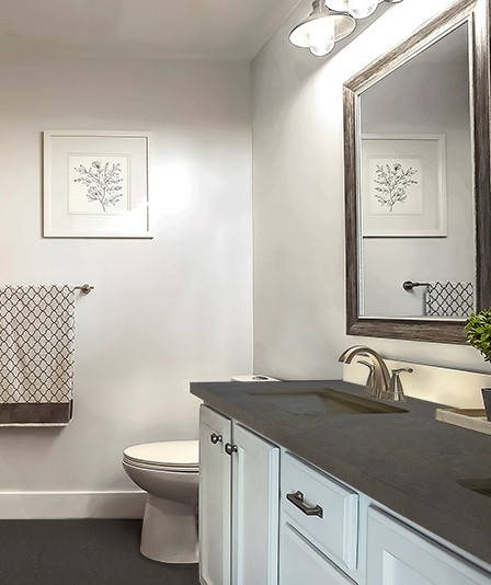 Baño con pared de microcemento y bañera blanca